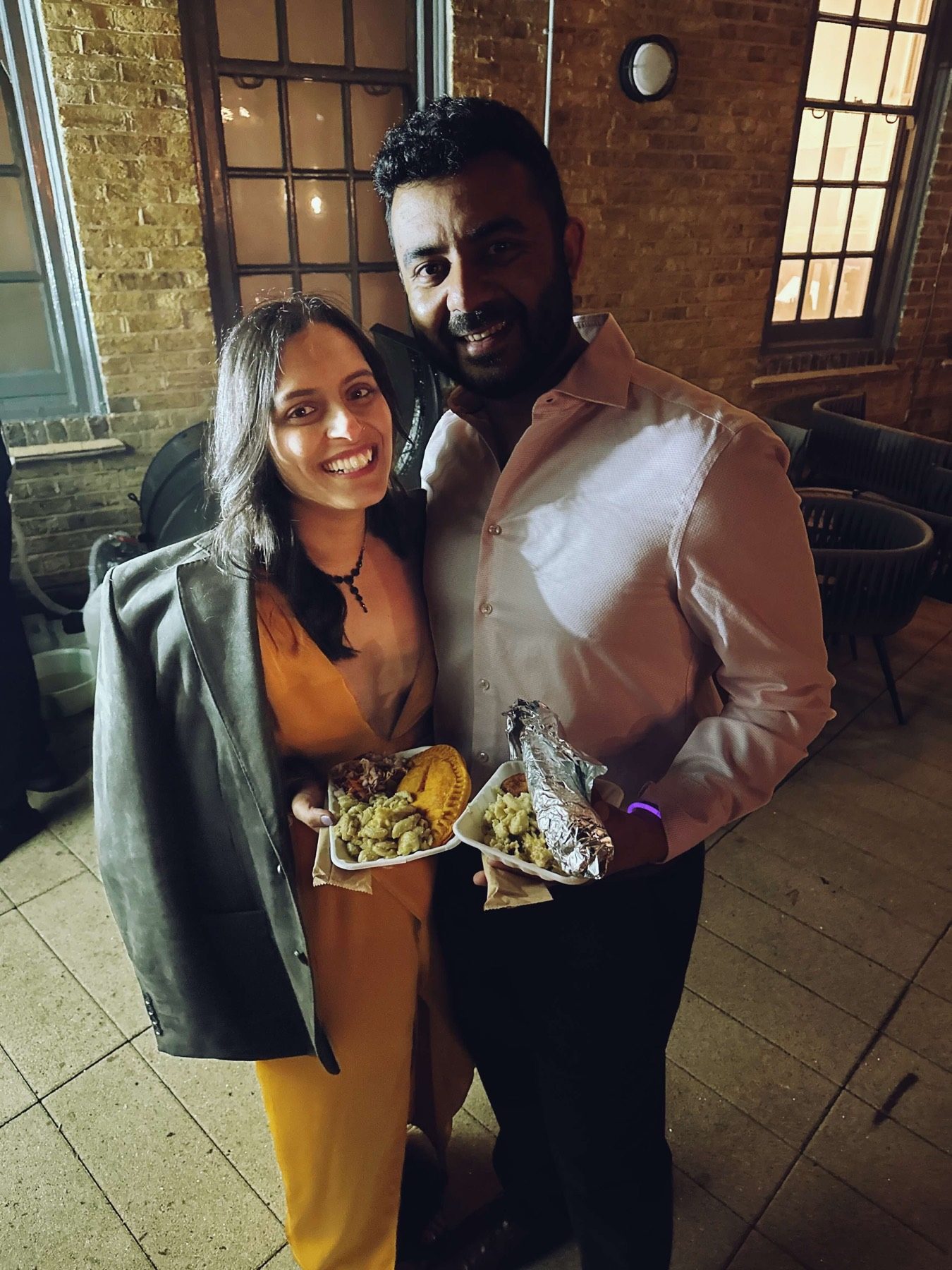 Guest enjoying plated food from The Jerk Shac catering
