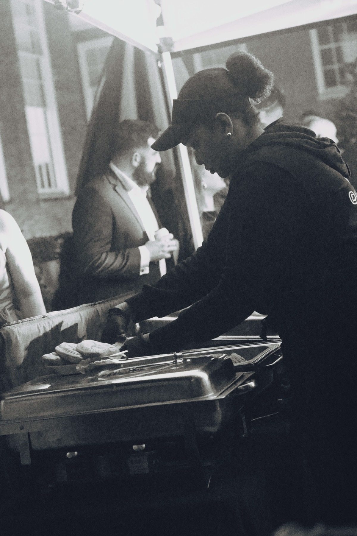 The Jerk Shac team serving from catering trays