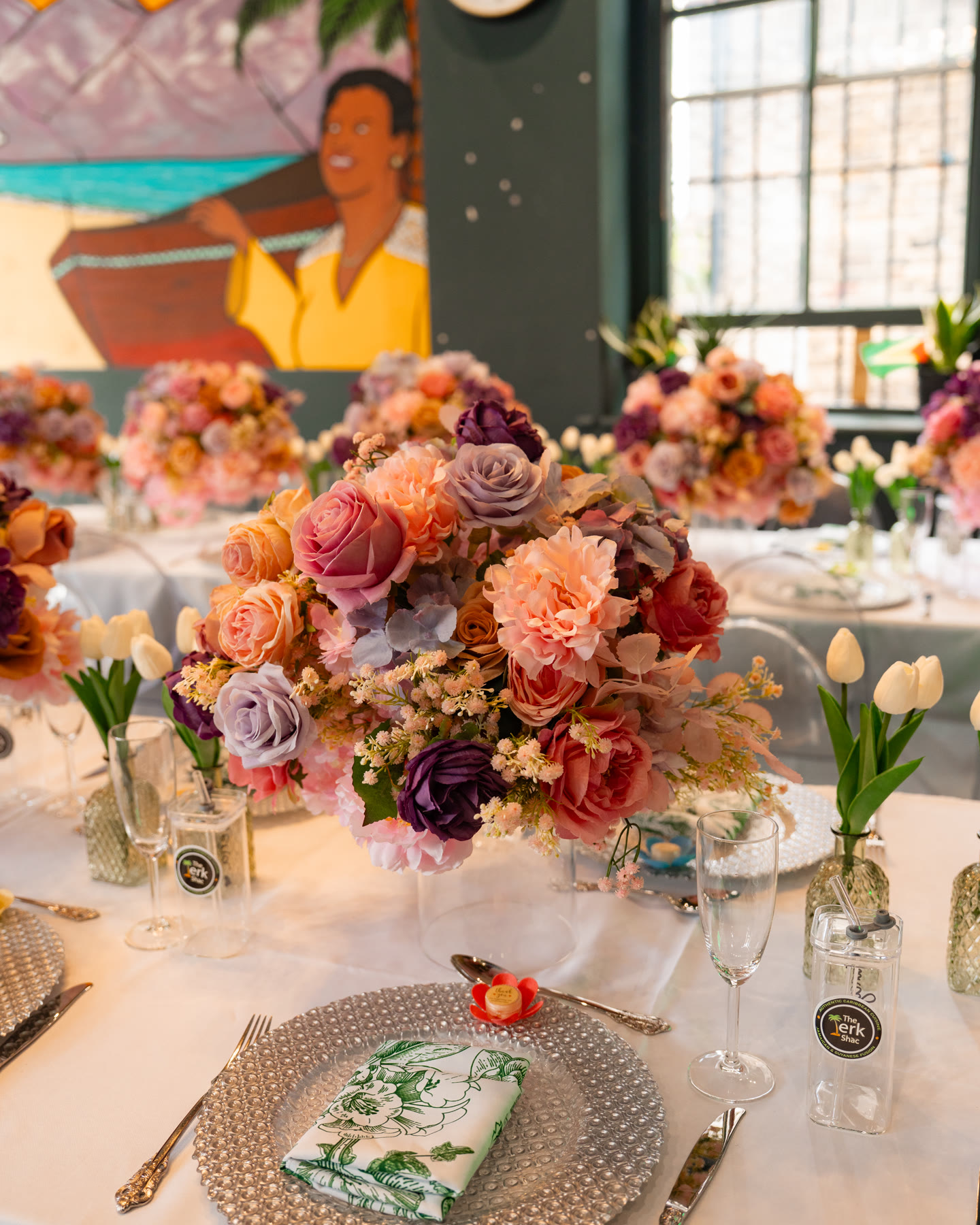 Close detail of a floral centrepiece and place setting